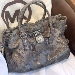 Python  on leather. Lock key included. 15" wide 14 inches high